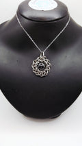 Sanctuary Studio handcrafted stainless steel chainmaille pendant necklace featuring a central black ceramic sphere.
